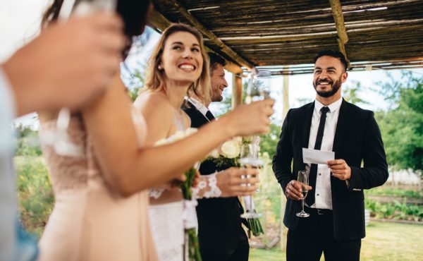 Best man performing speech for toast at wedding reception Wedding Insurance Options to Get Hitched Without a Hitch